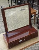 A 19th century mahogany three drawer toilet mirror