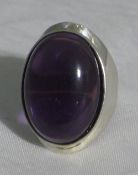 A silver and amethyst ring