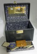 A box of miscellaneous items, including an inkwell,