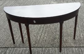 A mahogany demi-lune side table, a set of hanging shelves,