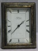 A Carr silver fronted clock