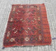 A red ground runner and a small rug