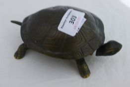 A bell in the form of a tortoise