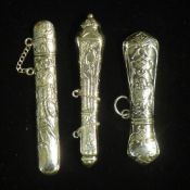 Three silver needle cases