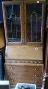 A 20th century oak bureau bookcase