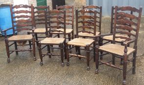 A set of eight ladder back dining chairs