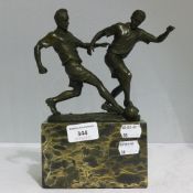 A bronze model of footballers