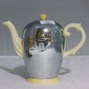 A Deco 'Heatmaster' teapot and four associated cups and saucers