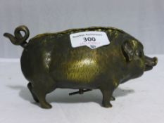 A bronze bell in the form of a pig