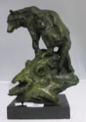 A bronze model of a wolf