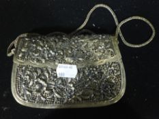 An Eastern pierced white metal purse