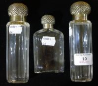 Three silver topped dressing table bottles