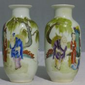 A pair of small Chinese coloured vases