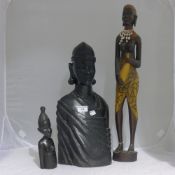 An African carved ebony bust and three other African carvings