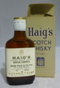 A boxed miniature Haig's 70% proof Scotch whisky