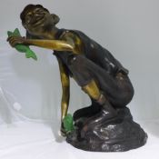 A bronze model of a garden pixie