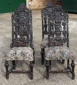 A set of four Victorian carved oak dining chairs