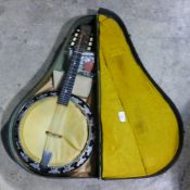 A cased Melody Major Savana 8-string banjo/mandolin