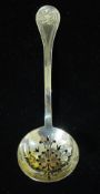 A silver sifter spoon