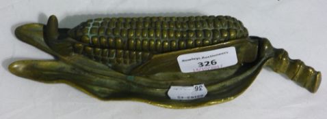 A brass corn on cob inkwell