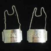 A pair of Concorde silver decanter labels,