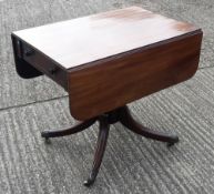 A Victorian mahogany pedestal Pembroke table