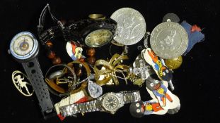 A tin of costume jewellery,