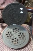 Two Victorian cast iron coal hole covers