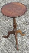 A small mahogany tripod table