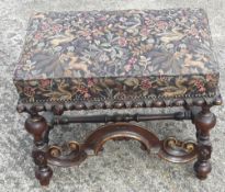 An 18th century style tapestry covered foot stool