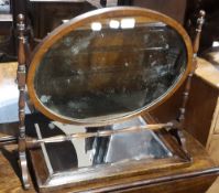 A Victorian mahogany dressing table mirror and an oak wall glass