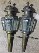 A pair of antique brass coaching lamps