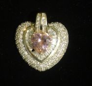 A silver and cubic zirconia heart shape pendant