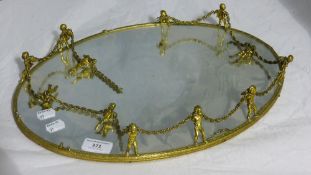 A cherub mounted mirrored tray