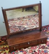 A 19th century mahogany three drawer dressing table mirror