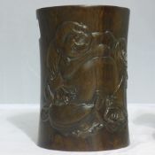 A Chinese carved wooden brush pot