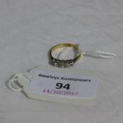 An 18 ct gold and platinum five stone diamond ring