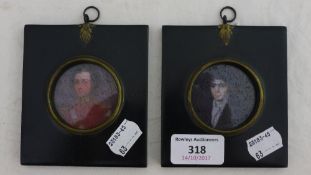 Two miniatures in black frames