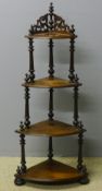 A Victorian walnut corner whatnot