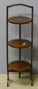 An Edwardian inlaid mahogany folding cake stand