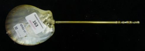 A mother-of-pearl spoon