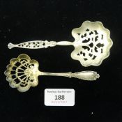 A silver sifter spoon and one other plated