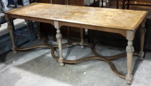 A 17th century style burr walnut dining table