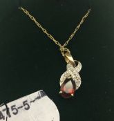 A modern 9 ct gold diamond and gemstone pendant and chain