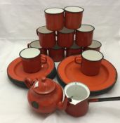 A quantity of red enamelled wares etc.