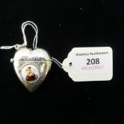 A silver vesta in the form of a heart