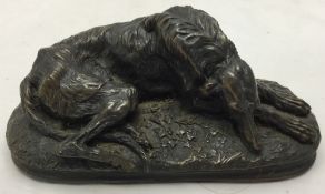 A bronzed model of a dog