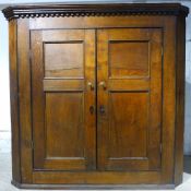 A George III oak corner cupboard