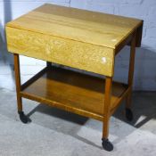 A vintage oak two tier tea trolley