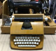 A Singer sewing machine and a Petite typewriter